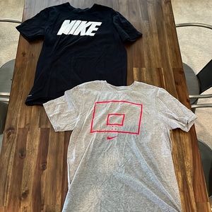 Two Nike Dri-Fit basketball shirts